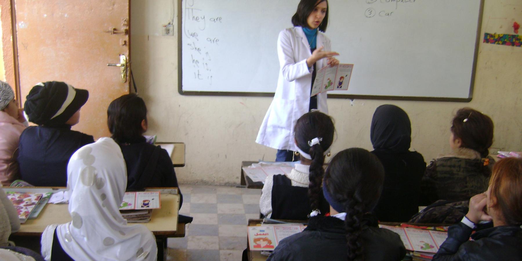 Dr. Sarah Al-Obaydi leads a health education session at a school in rural Iraq. 