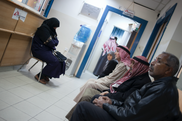 New registered patient Mohamed 64 years old from Damascus (front right of picture) is waiting for his medical consultation with MSF doctor after his first check up with MSF nurse. © N'gadi Ikram / Courtesy of MSF